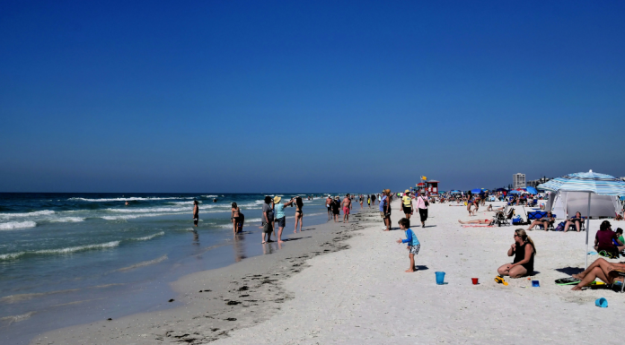 Siesta Key: The Perfect Family Beach Getaway {Road Trip Series} Image: Families enjoy the beach on Siesta Key