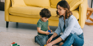 PrTMS: Non-Invasive Treatment for Optimal Brain Health Image: A mother and son playing with Legos