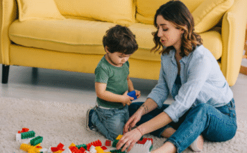 Image: A mother and son playing with Legos