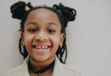 Pediatric Airway Evaluations & 5 Benefits of Early Intervention Image: An elementary aged child with pigtails smiles for the camera