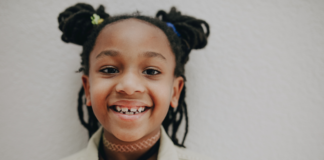 Pediatric Airway Evaluations & 5 Benefits of Early Intervention Image: An elementary aged child with pigtails smiles for the camera