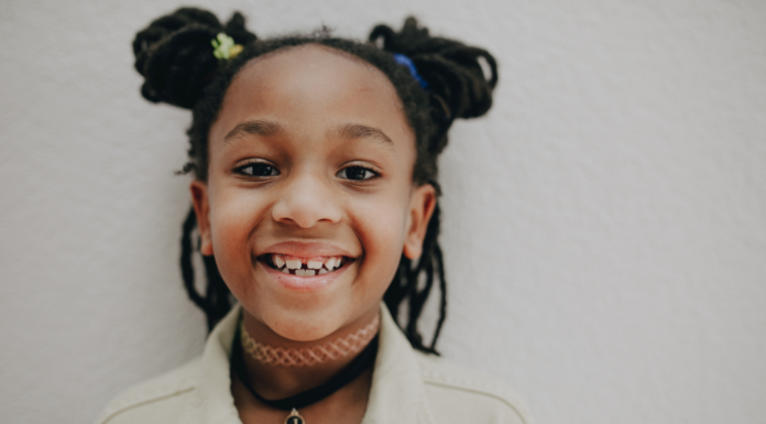 Pediatric Airway Evaluations & 5 Benefits of Early Intervention Image: An elementary aged child with pigtails smiles for the camera