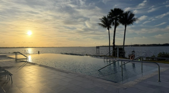 voco Sandpiper Bay: A Family-Friendly All-Inclusive Resort Image: A sunset view of the infinity pool at voco Sandpiper Bay All-Inclusive Resort