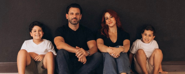 Image: A family poses for a photo